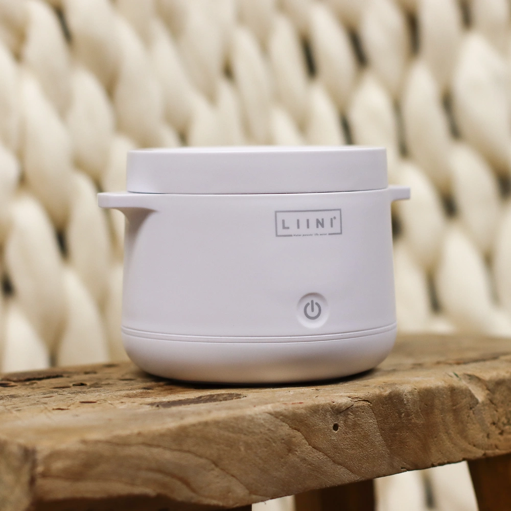 Scalda porridge in movimento per la pappa del bambino Scalda porridge in movimento per la pappa del bambino