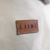LIINI Babytrage graubeige Lederpatch LIINI Babytrage graubeige Lederpatch